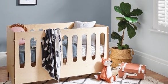 Picture of wooden cot in baby's room
